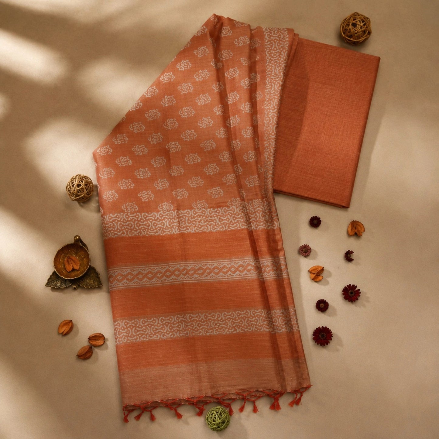 Burnt Orange Tussar Batik Saree with White Handcrafted Motifs and Tassel Pallu
