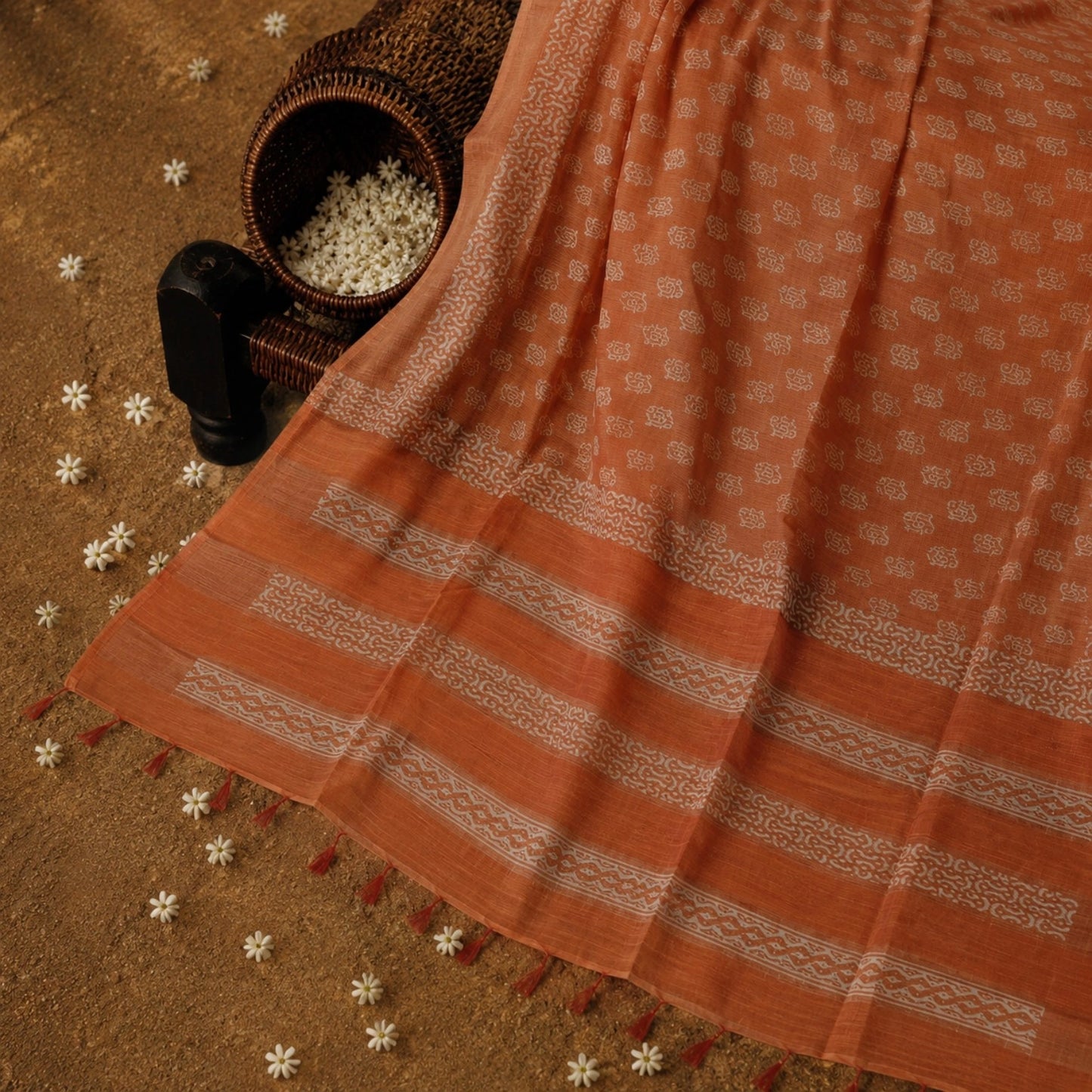 Burnt Orange Tussar Batik Saree with White Handcrafted Motifs and Tassel Pallu