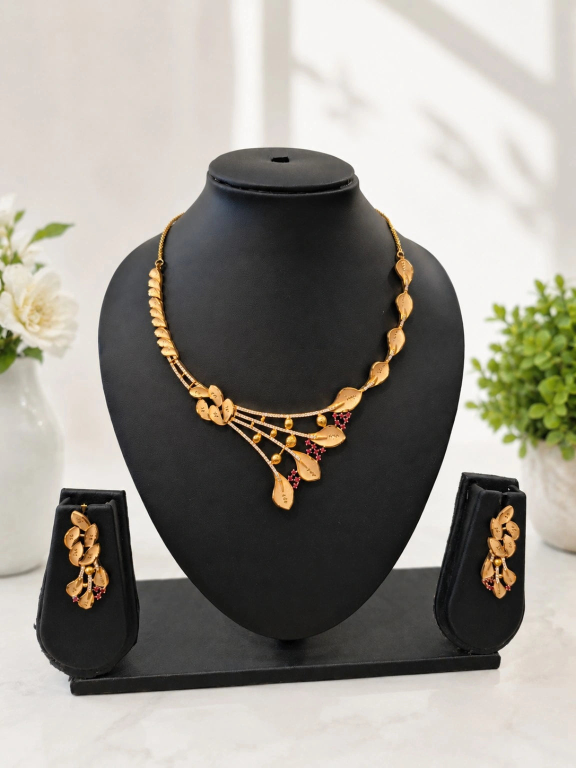 Gold-Tone Leaf Motif Necklace Set with Pink Stone Embellishments