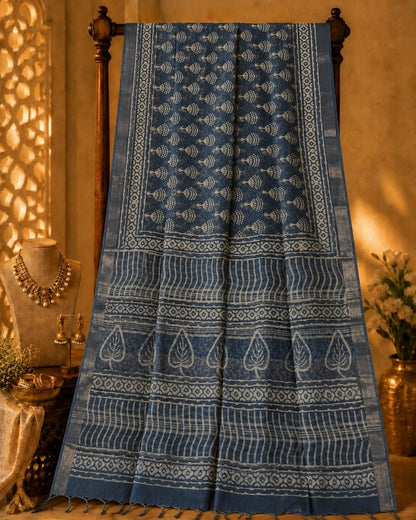 Indigo Blue Linen Printed Saree with Tribal Floral Motifs and Leaf Border Design