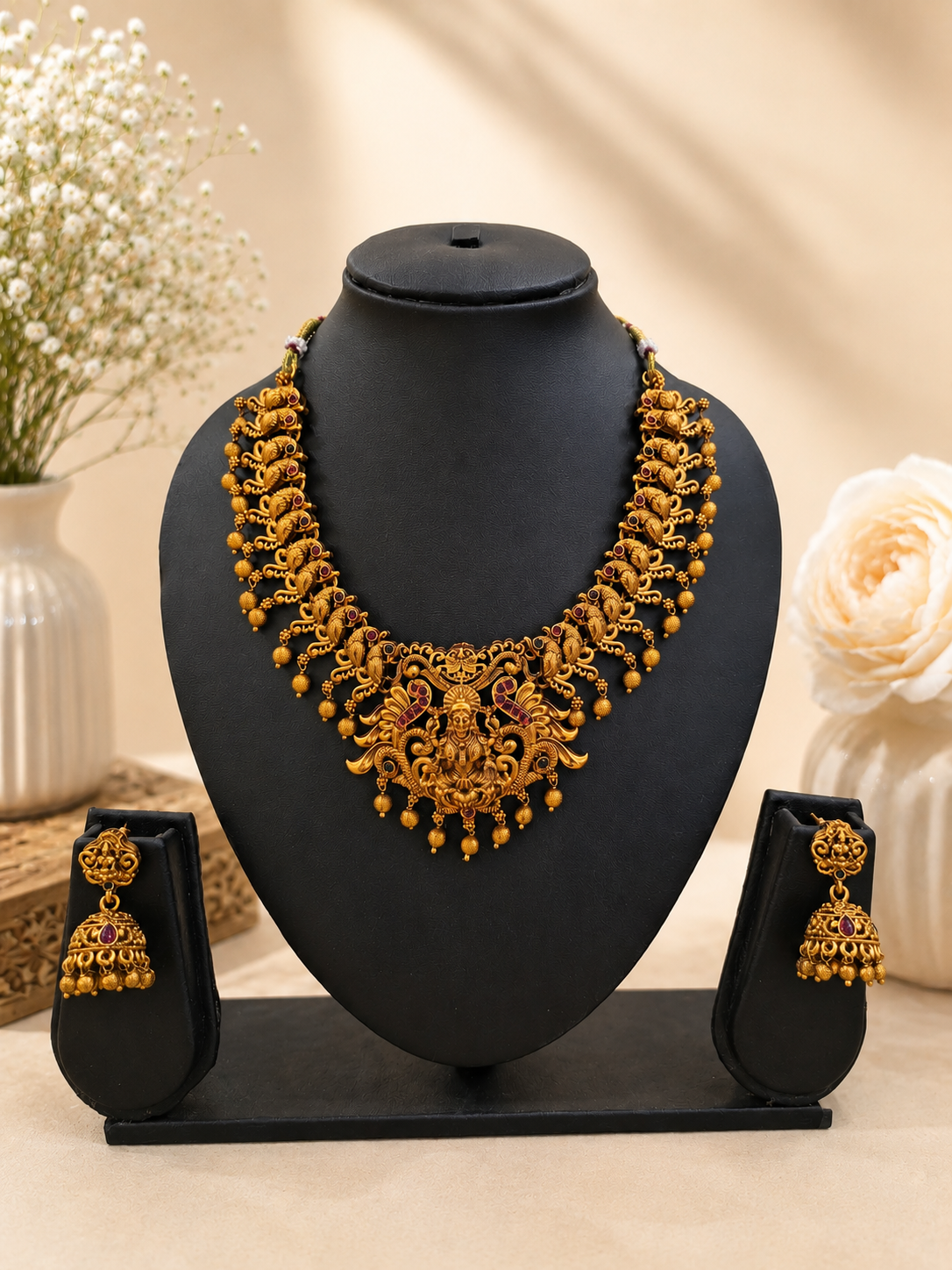 Traditional Gold-Tone Necklace Set with Intricate Temple Motifs and Jhumka Earrings