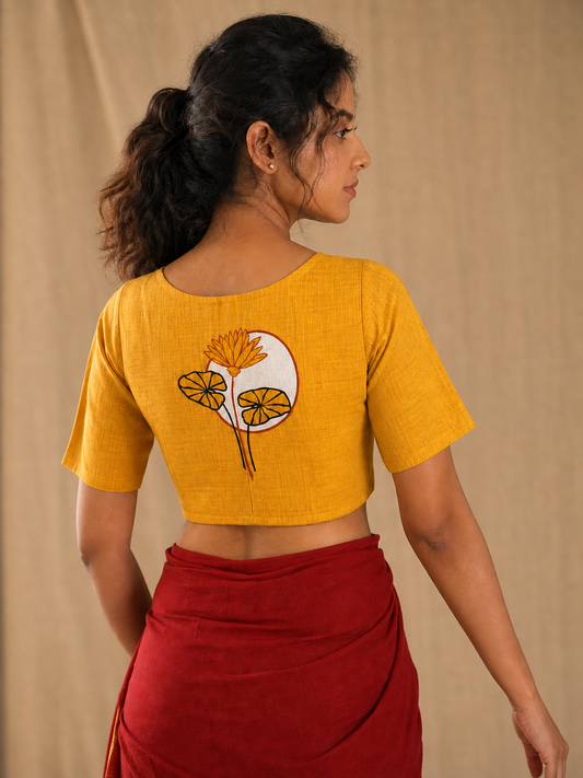 Mustard textured Poila Baishakh blouse worn by model, back view