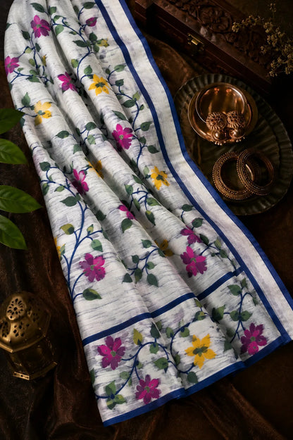 White Muslin Bonolota Saree with Multicolor Floral Vine Print and Royal Blue Border