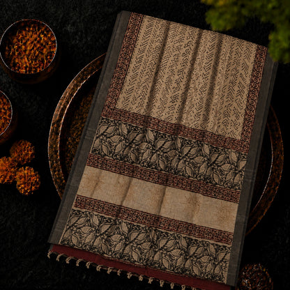 Beige Linen Kalamkari Saree with Tribal Print Body & Artistic Floral Border