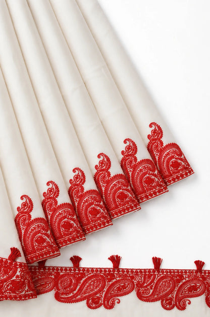 White Soft Georgette Saree with Red Paisley Embroidered Border & Tassel Detailing