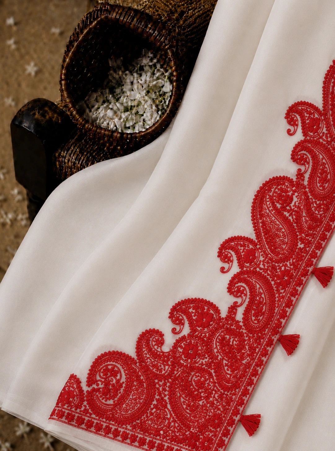 White Soft Georgette Saree with Red Paisley Embroidered Border & Tassel Detailing