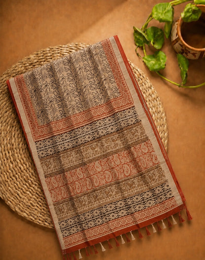 Beige Linen Kalamkari Saree with Tribal Art Print, Paisley Border & Tassel Pallu