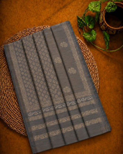 Charcoal Grey Tussar Batik Saree with Beige Floral Motifs and Artistic Border Design